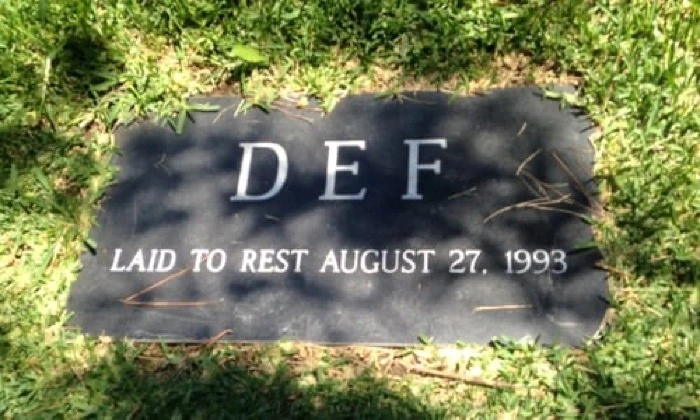 A gravestone for the word 'Def'